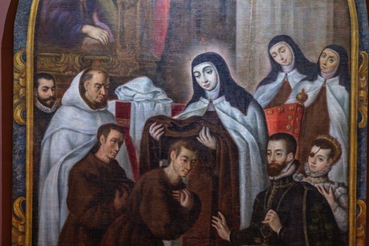 Cuadro con Santa Teresa de Jesús en el centro y en un lateral los príncipes de Éboli.